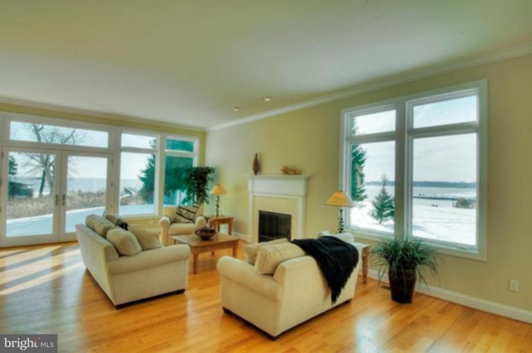 1405 Sharps Point Road Annapolis, MD 21409 - Photo 13 of 14 a living room with furniture and a fireplace