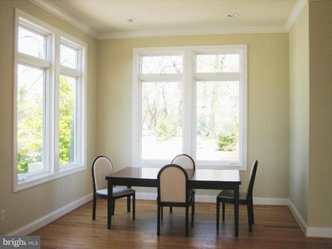 1405 Sharps Point Road Annapolis, MD 21409 - Photo 3 of 14 a dining room with furniture and wooden floor