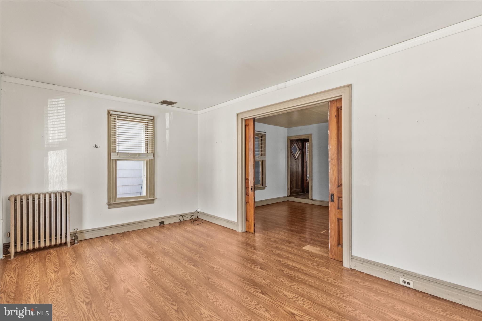 220 Locust Street Hanover, PA 17331 - Photo 6 of 42 Living room with pocket doors open