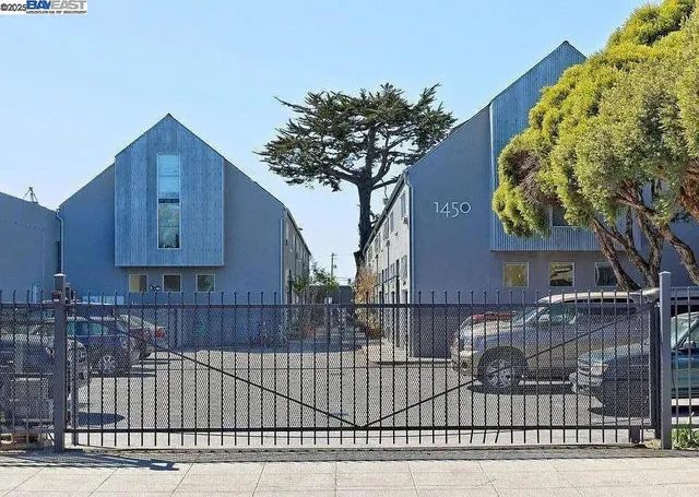 a view of a house with a iron fence