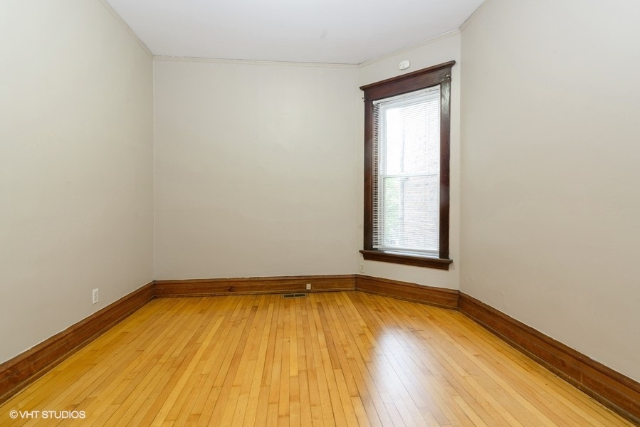 1312 West Nelson Street, Unit 1 Chicago, IL 60657 - Photo 12 of 12 a view of a room with wooden floor and small window