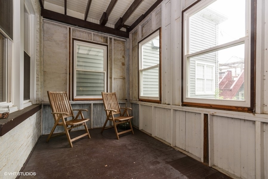 1312 West Nelson Street, Unit 1 Chicago, IL 60657 - Photo 7 of 12 a view of a room with chairs and windows