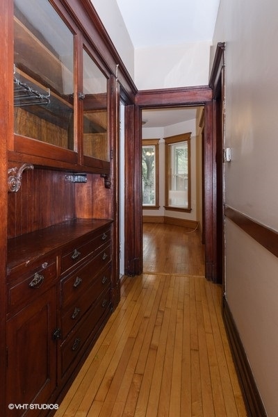1312 West Nelson Street, Unit 1 Chicago, IL 60657 - Photo 8 of 12 a view of hallway with wooden floor