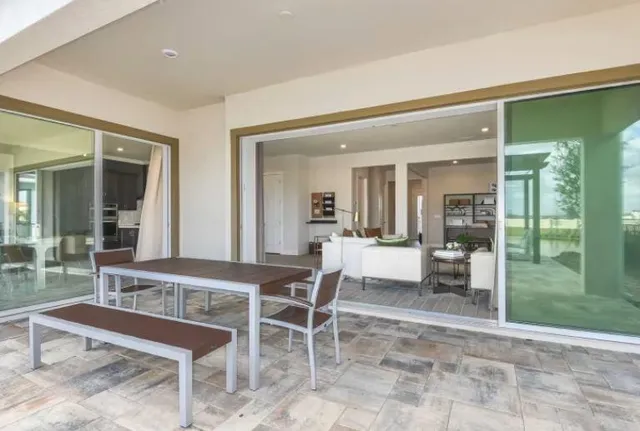 a kitchen with granite countertop a refrigerator sink and stove