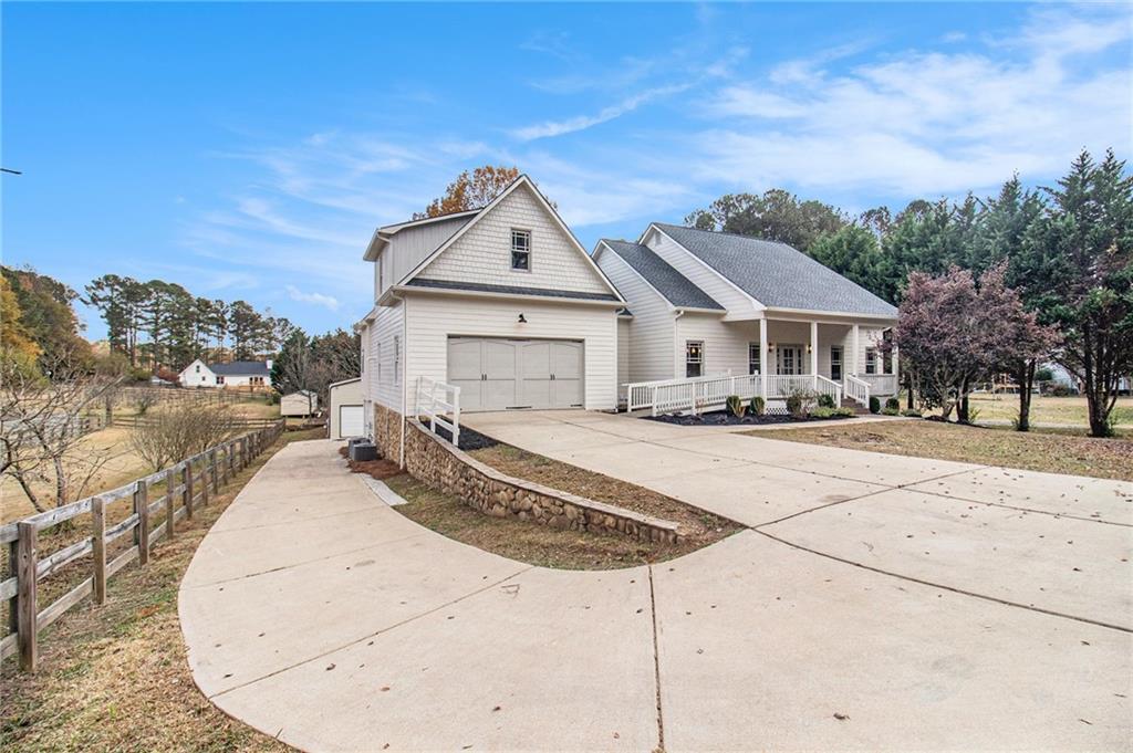 a view of a white house with a large windows
