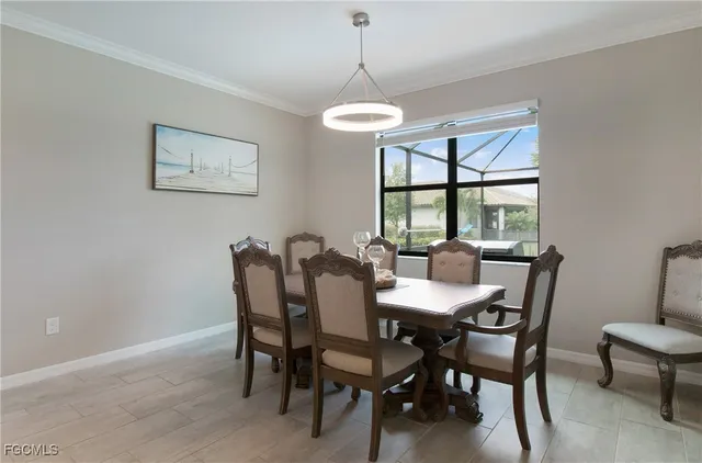 a dining room with furniture and window