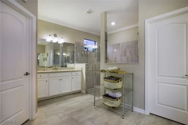 a bathroom with a sink vanity and mirror