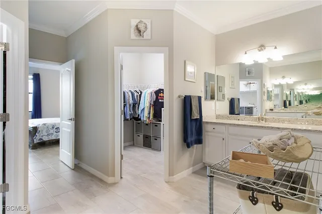 a kitchen with stainless steel appliances kitchen island granite countertop a refrigerator and cabinets
