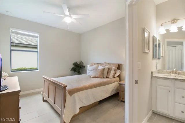 a bedroom with a bed and a table