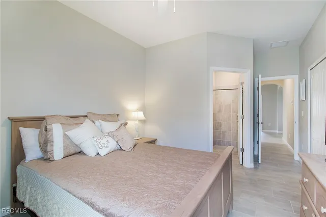 a bedroom with a bed and a cabinets