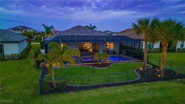 a view of a big house with a big yard and potted plants