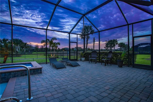 a view of a swimming pool with a patio