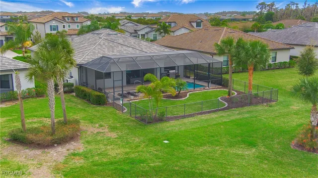 a view of a house with backyard and a garden
