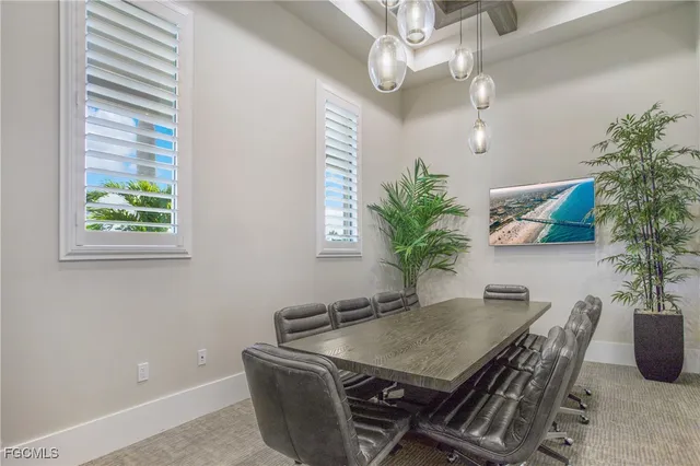 an aerial view of a house with a garden and lake view