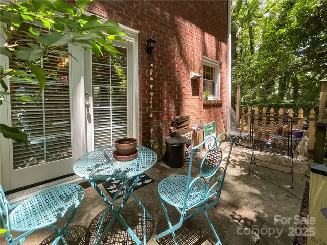 a backyard of a house with outdoor seating