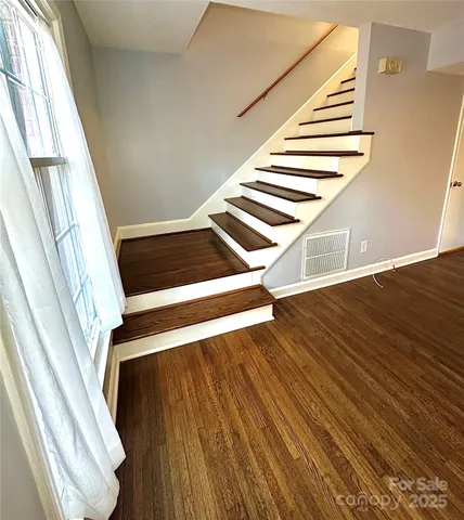 a view of entryway with wooden floor