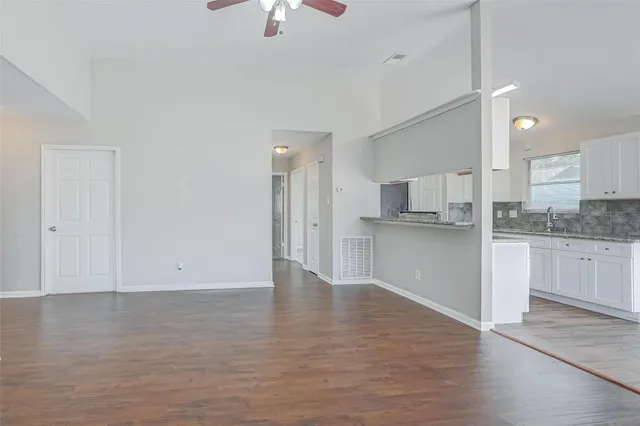 a view of kitchen with wooden floor