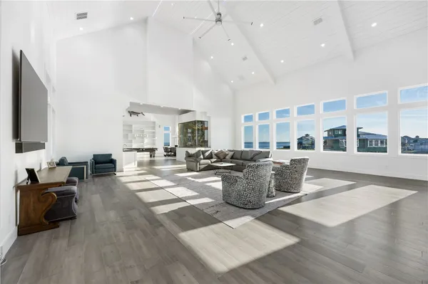a living room with lots of furniture and a flat screen tv