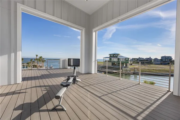 a view of a balcony with wooden floor