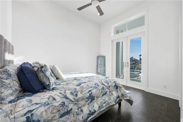a bedroom with a bed and a mirror