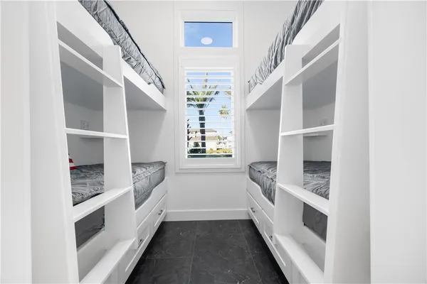 a bathroom with a double vanity sink and mirror