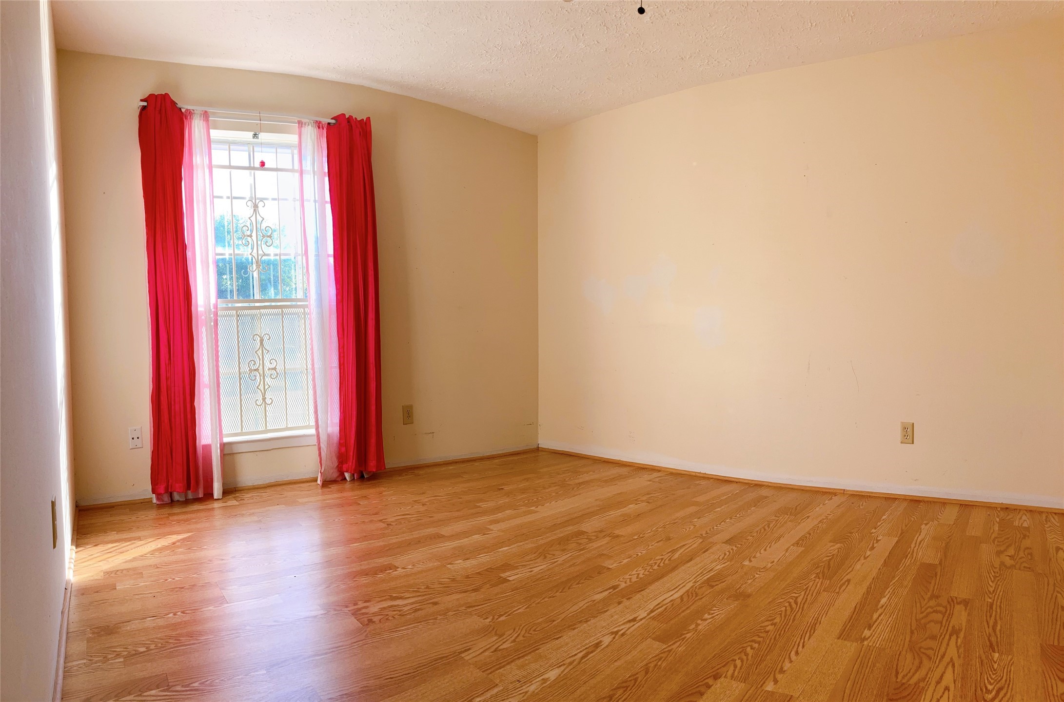 19518 Munsey Court Katy, TX 77449 - Photo 19 of 45 a view of an empty room with wooden floor and a window