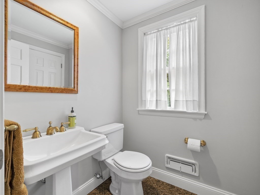 45 Cartwright Road Wellesley, MA 02482 - Photo 12 of 26 a bathroom with a toilet sink and mirror
