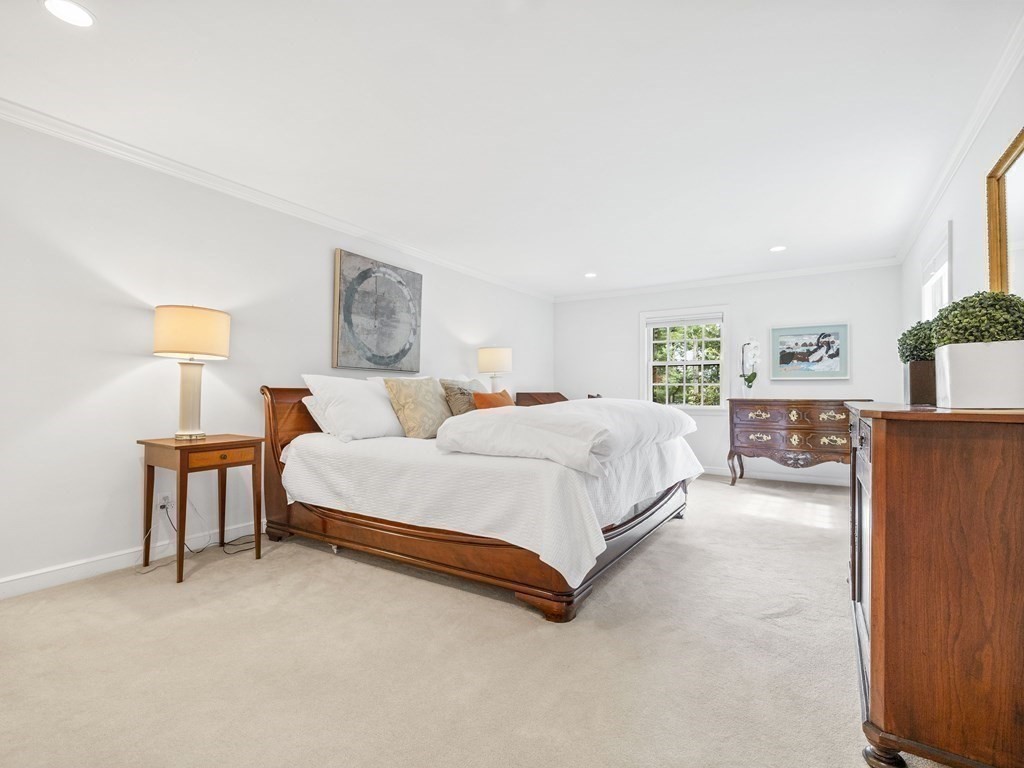 45 Cartwright Road Wellesley, MA 02482 - Photo 13 of 26 a spacious bedroom with a bed and a lamp