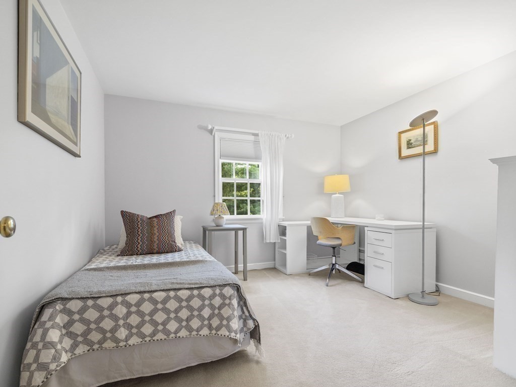 45 Cartwright Road Wellesley, MA 02482 - Photo 17 of 26 a bedroom with a bed and a cabinets