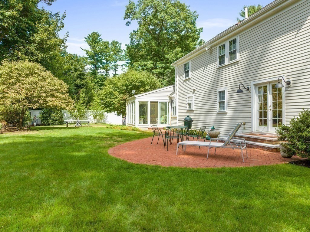 45 Cartwright Road Wellesley, MA 02482 - Photo 23 of 26 a view of backyard of house with a patio