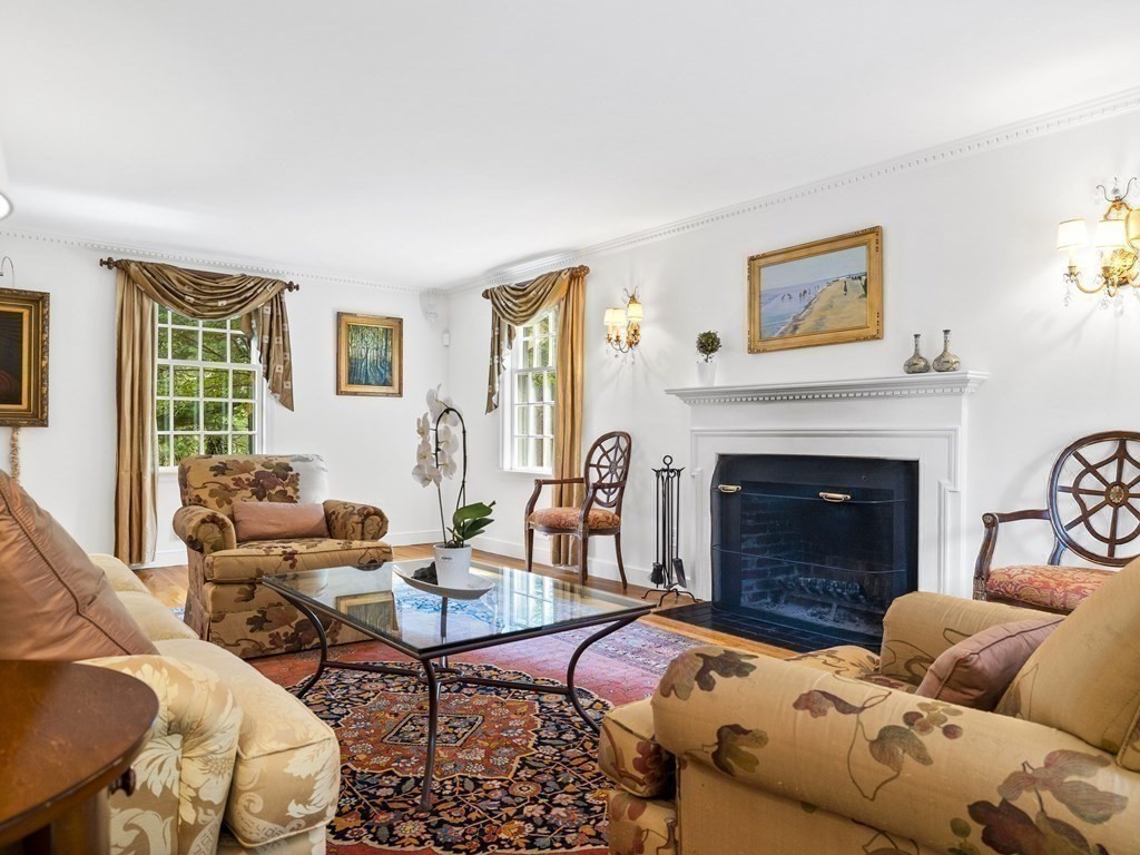 45 Cartwright Road Wellesley, MA 02482 - Photo 4 of 26 a living room with furniture and a fireplace
