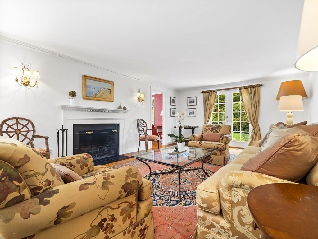 45 Cartwright Road Wellesley, MA 02482 - Photo 5 of 26 a living room with furniture and a fireplace