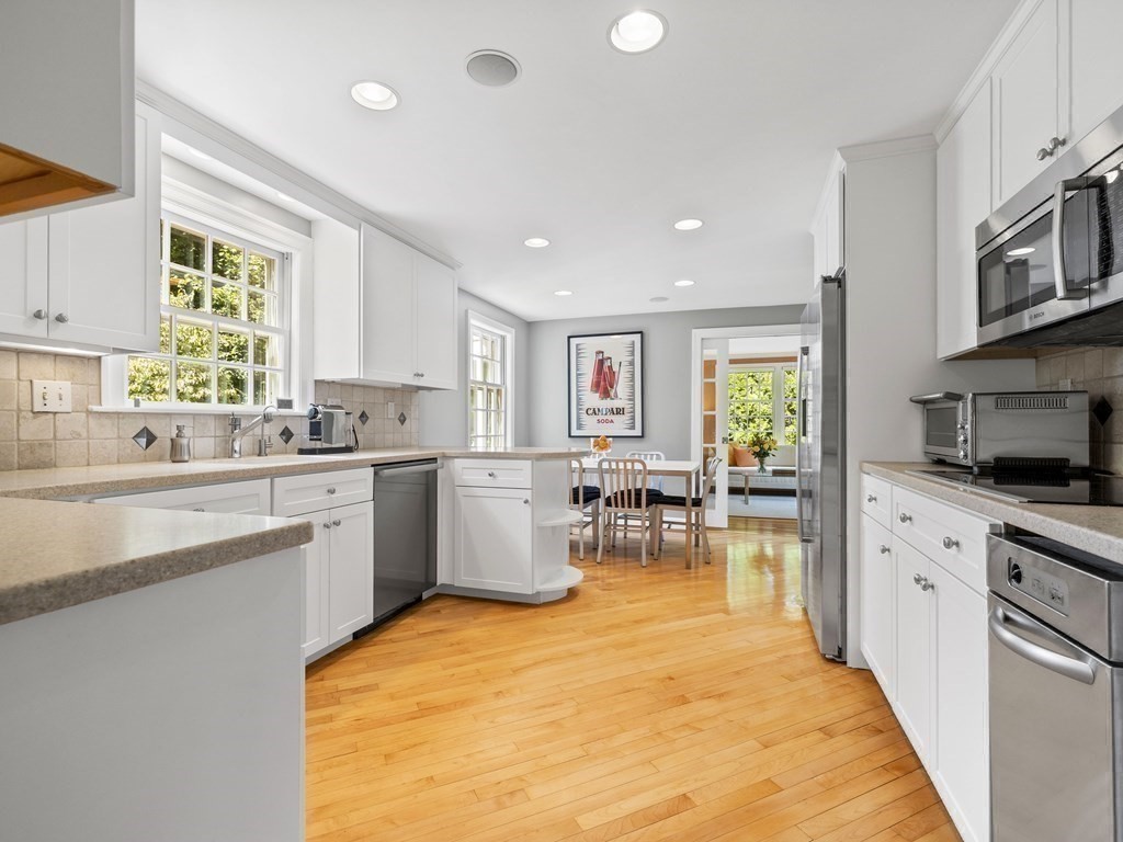 45 Cartwright Road Wellesley, MA 02482 - Photo 10 of 26 a kitchen with counter top space appliances and windows