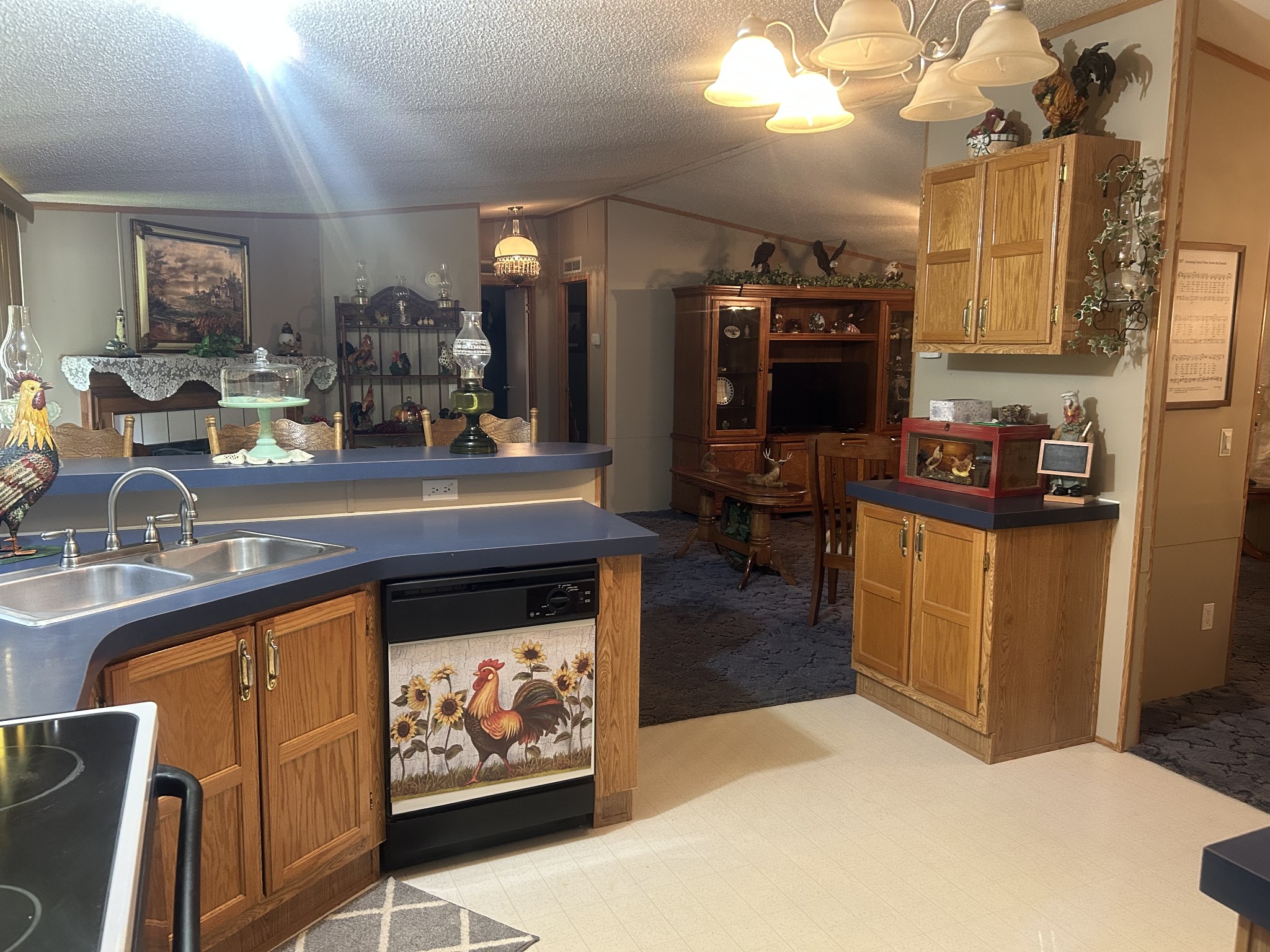 550 Sales Landing Road Camden, TN 38320 - Photo 15 of 27 a kitchen with stainless steel appliances granite countertop a stove and a sink