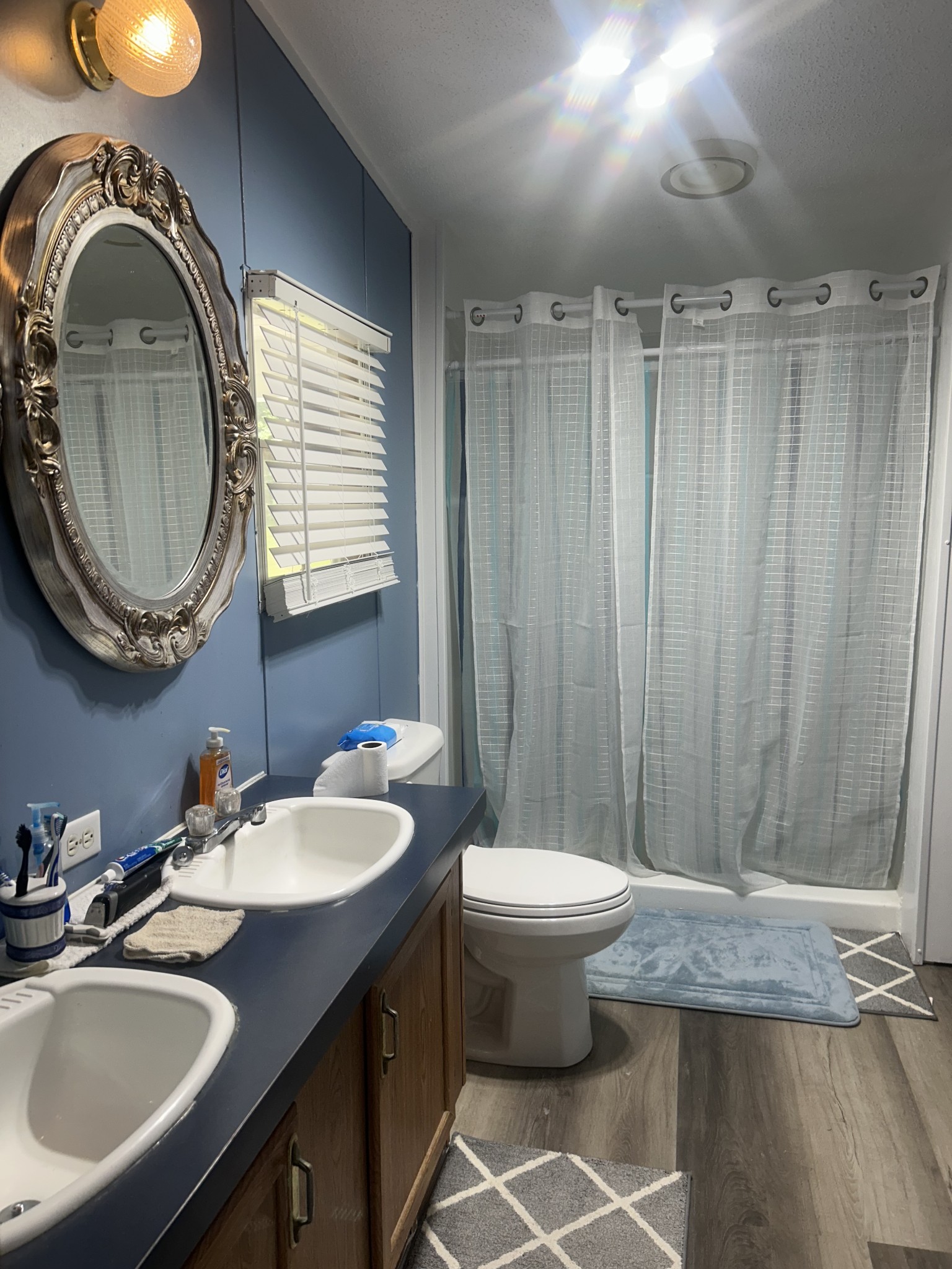 550 Sales Landing Road Camden, TN 38320 - Photo 23 of 27 a bathroom with a sink and a mirror