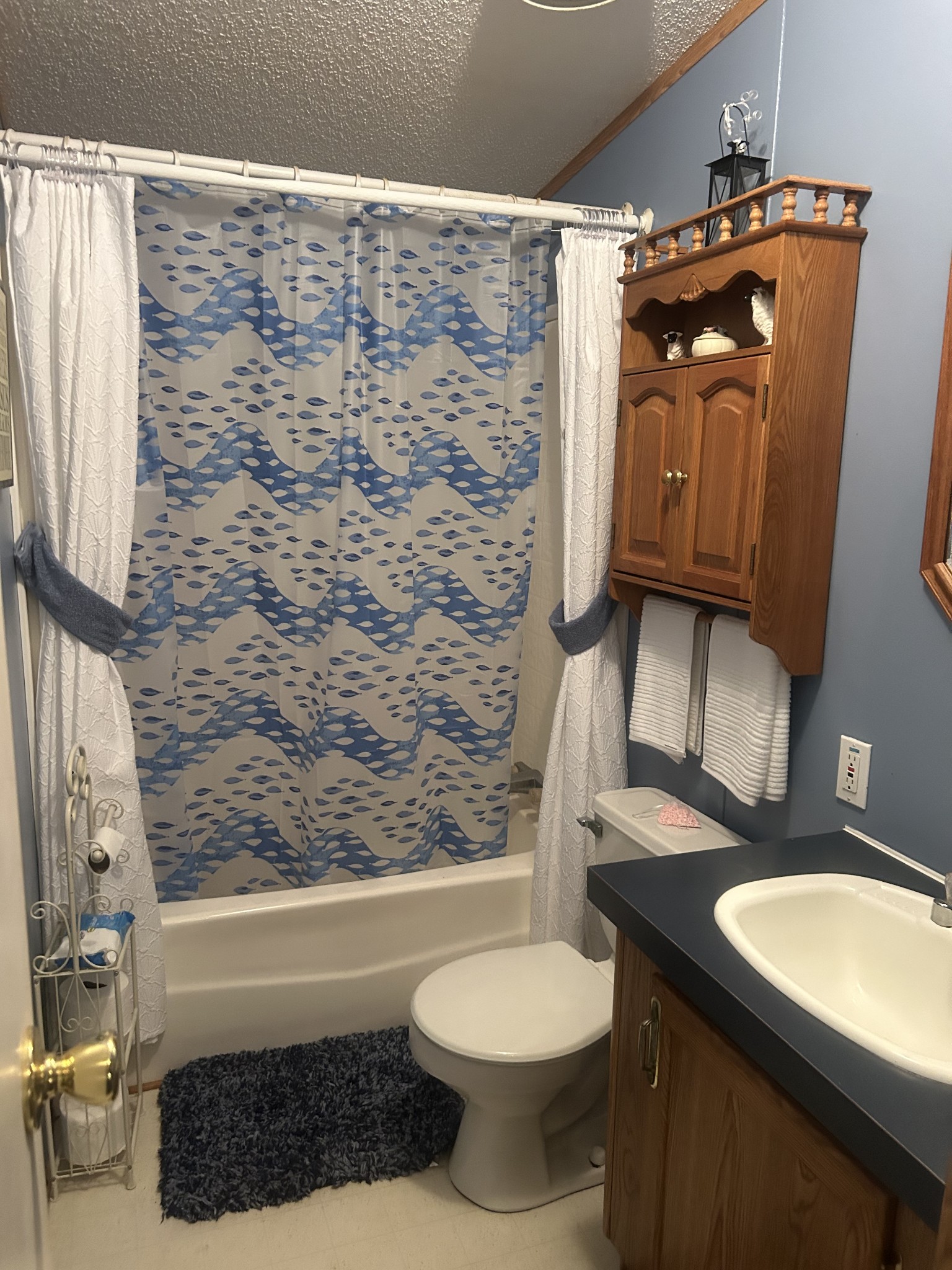 550 Sales Landing Road Camden, TN 38320 - Photo 26 of 27 a bathroom with a granite countertop toilet sink and mirror