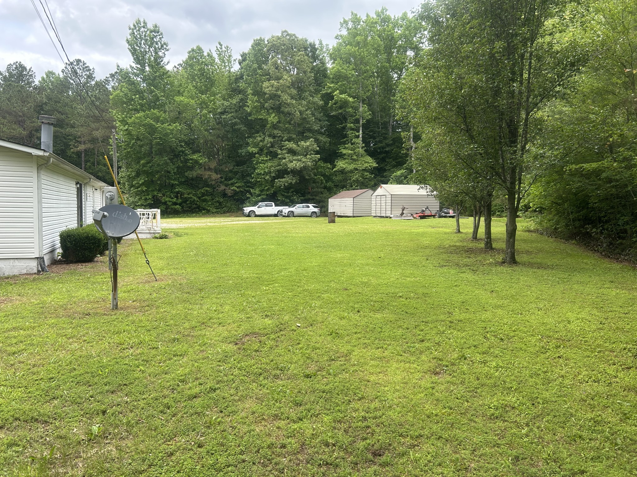550 Sales Landing Road Camden, TN 38320 - Photo 5 of 27 a backyard of a house with lots of green space