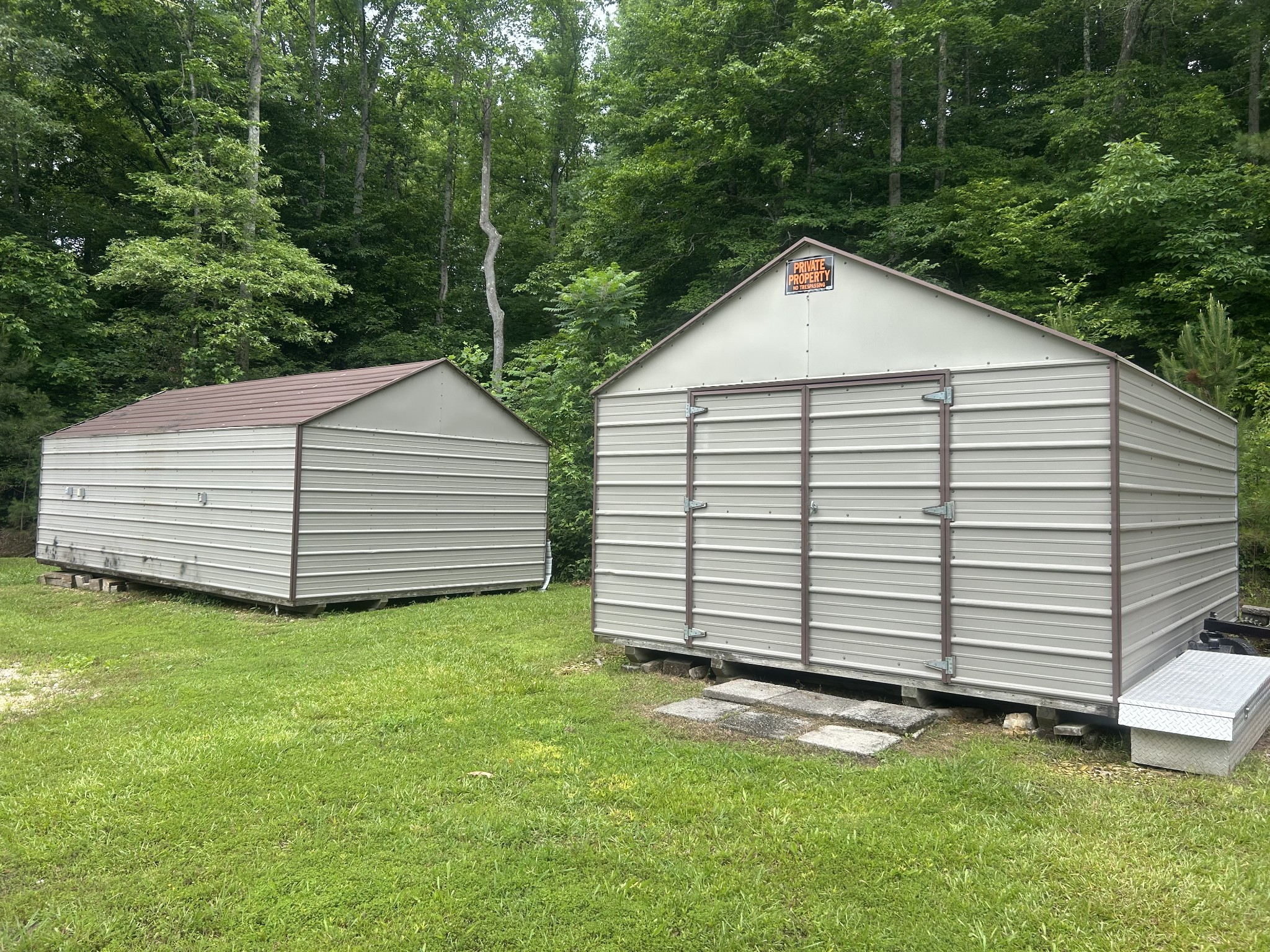 550 Sales Landing Road Camden, TN 38320 - Photo 6 of 27 a view of a white house with a yard and garage