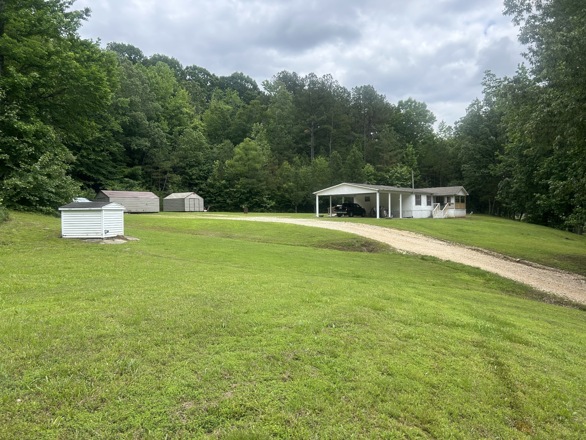 550 Sales Landing Road Camden, TN 38320 - Photo 9 of 27 a view of a house with a big yard