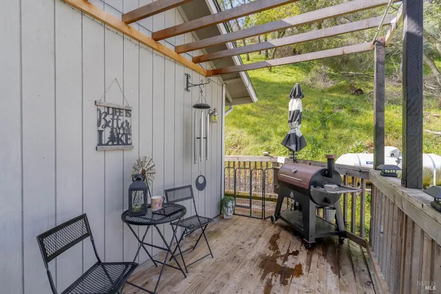 a view of an outdoor dining space with furniture and garden view