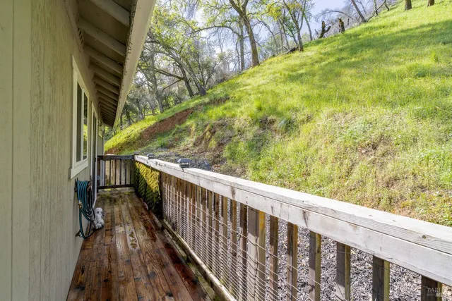 a view of balcony with wooden floor