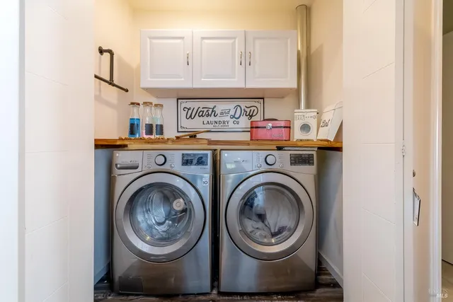 a view of livingroom with washer and dryer