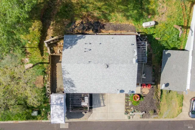 an aerial view of a house with outdoor space