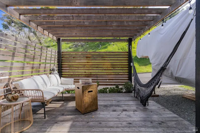 a view of a chairs and table in patio