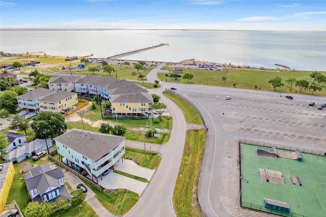 an aerial view of a house with a ocean view