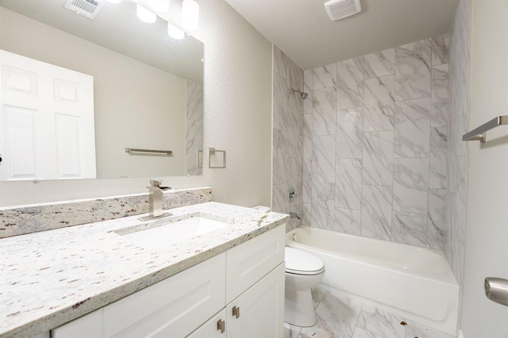 1032 Springview Lane Mabank, TX 75147 - Photo 11 of 15 Full bathroom featuring light marble finish floors, shower / tub combination, and vanity