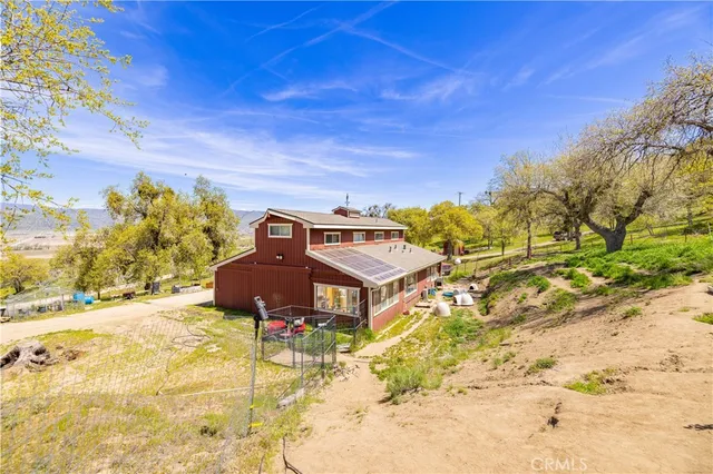 a house with trees in the background