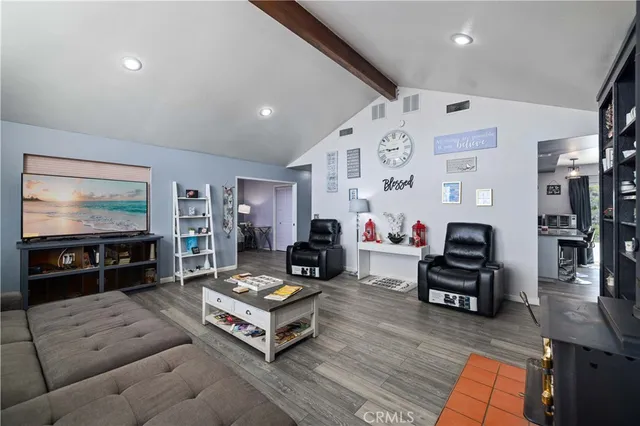 a living room with furniture or couch and a wooden floor