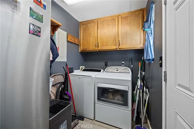 a kitchen with stainless steel appliances granite countertop a refrigerator and a stove