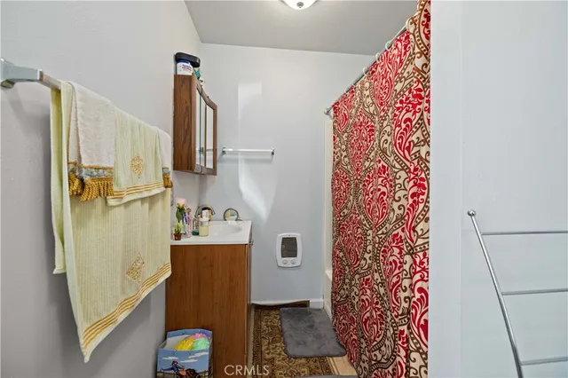 a bedroom with furniture and a wooden floor